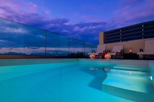 a swimming pool with a view of the sky at Villa Arilia in Agnítsini +48 photos