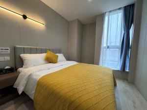 Katil atau katil-katil dalam bilik di KeTangJian Aparthotel