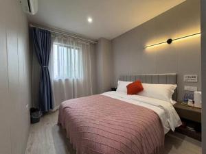 Katil atau katil-katil dalam bilik di KeTangJian Aparthotel