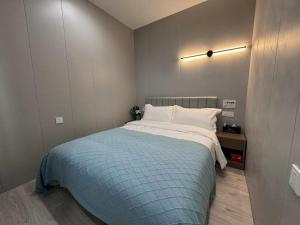 Katil atau katil-katil dalam bilik di KeTangJian Aparthotel