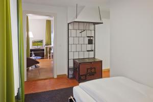 Letto o letti in una camera di Boutique-Hotel Auberge Langenthal