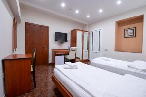 Postel nebo postele na pokoji v ubytování Mia Casa Hotel Yerevan
