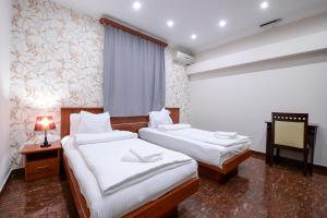 Postel nebo postele na pokoji v ubytování Mia Casa Hotel Yerevan