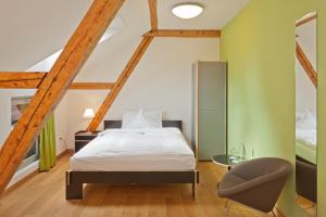 Letto o letti in una camera di Boutique-Hotel Auberge Langenthal
