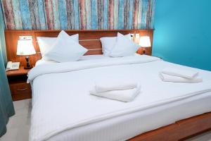 Postel nebo postele na pokoji v ubytování Mia Casa Hotel Yerevan