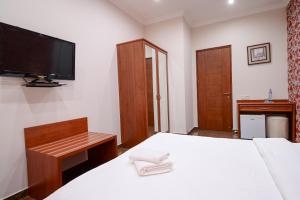 Postel nebo postele na pokoji v ubytování Mia Casa Hotel Yerevan