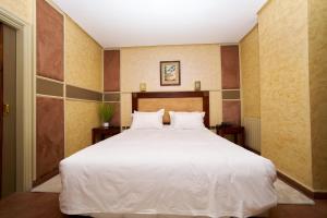 Voodi või voodid majutusasutuse Hotel Bab Mansour toas
