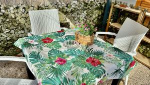 a table with a table cloth with flowers on it at The Dream in Massa Lubrense