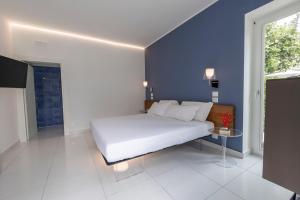Postel nebo postele na pokoji v ubytování Aquamaris Design Suite & Spa
