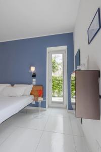 Postel nebo postele na pokoji v ubytování Aquamaris Design Suite & Spa