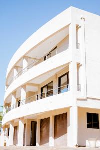 an image of a white building at Guest House Auasblick by State House in Windhoek
