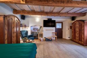 TV a/nebo společenská místnost v ubytování Apartmán v Jesenické továrně + 8 fotografií
