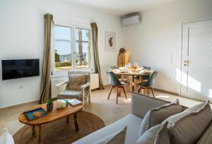 a living room with a couch and a table at Azula Luxury Apartments in Parikia