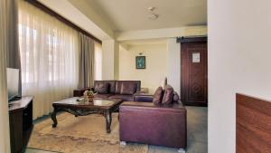 a living room with a couch and a coffee table at Royal View Villa in Ohrid