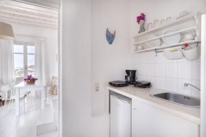 Eldhús eða eldhúskrókur á Fos Apartments Mykonos