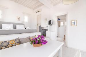 Rúm í herbergi á Fos Apartments Mykonos