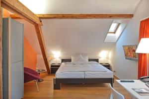 Letto o letti in una camera di Boutique-Hotel Auberge Langenthal