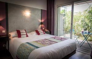 Postel nebo postele na pokoji v ubytování Golfe Hôtel & Spa Porto-Vecchio