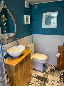 a bathroom with a sink and a toilet at McHoppity House Crail, Sleeps 6, Free Parking in Crail