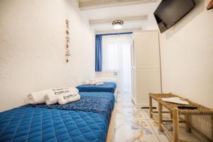 Postel nebo postele na pokoji v ubytování Étoiles Guest House