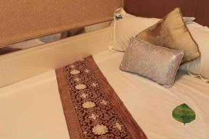 Uma cama ou camas num quarto em Payless A2 Guest House