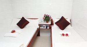 Uma cama ou camas num quarto em Payless A2 Guest House