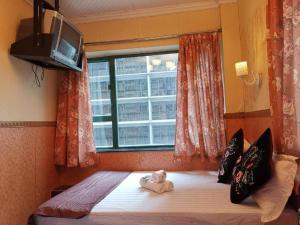 Uma cama ou camas num quarto em Payless A2 Guest House