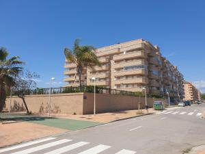 an empty street in front of a tall building at Playa R76MED012 in La Estación