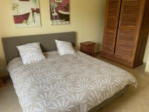 a bedroom with a large bed with two pillows at maison COSY LES FORGES in Les Forges +15 photos