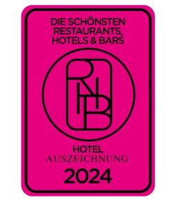 a pink sign with the words hotel at Das Royal in Bad Füssing