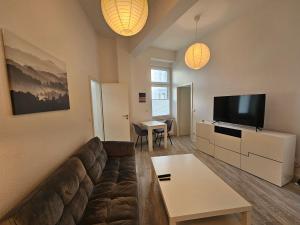 TV a/nebo společenská místnost v ubytování Wohnung SG-Ohligs nahe Hauptbahnhof, fix in Köln/Düsseldorf