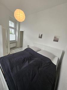 Postel nebo postele na pokoji v ubytování Wohnung SG-Ohligs nahe Hauptbahnhof, fix in Köln/Düsseldorf