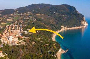 an aerial view of an island with a yellow arrow at Camera Vista Mare Sunrise-Top Panorama in Sirolo in Sirolo