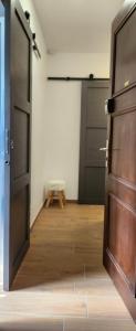 an open door in a room with a wooden floor at Mont de Grange - Châtel - Alp'in C in Châtel