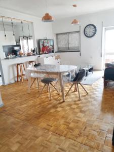 a kitchen with a table and chairs in a room at One bedroom apartement with furnished balcony at Pombal in Pombal