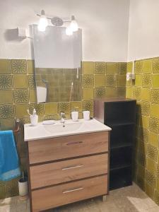 a bathroom with a sink and a mirror at One bedroom apartement with furnished balcony at Pombal in Pombal