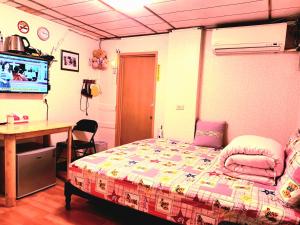 Katil atau katil-katil dalam bilik di Yun Cheng Homestay