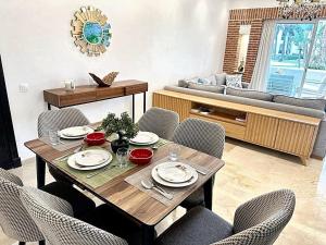 a dining room with a table and chairs at Comfortable Apartment with Pool in Agadir in Agadir