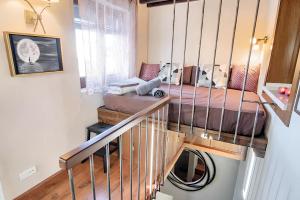 a small room with a bed and a staircase at One bedroom apartement with city view furnished terrace and wifi at Granada in Granada