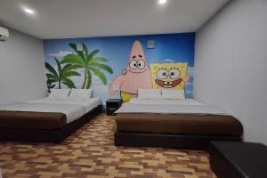 Postel nebo postele na pokoji v ubytování Nova Hotel, Ipoh Tambun