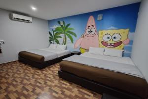 Postel nebo postele na pokoji v ubytování Nova Hotel, Ipoh Tambun