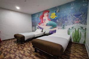 Postel nebo postele na pokoji v ubytování Nova Hotel, Ipoh Tambun
