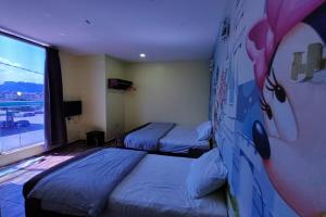 Postel nebo postele na pokoji v ubytování Nova Hotel, Ipoh Tambun