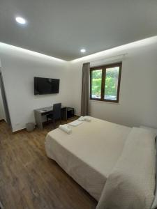 Posteľ alebo postele v izbe v ubytovaní Qvattro stagioni panoramic suites