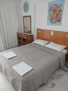 Postel nebo postele na pokoji v ubytování Danae Hotel