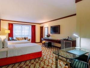 Postel nebo postele na pokoji v ubytování Mövenpick Hotel & Residences Nairobi