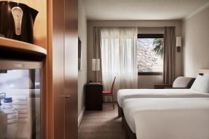 Postel nebo postele na pokoji v ubytování Novotel Athens