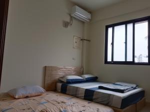 Krevet ili kreveti u jedinici u okviru objekta 南州民宿 NanChou Guesthouse