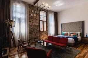 Postel nebo postele na pokoji v ubytování The Old Clare by Ode Hotels + 37 fotografií