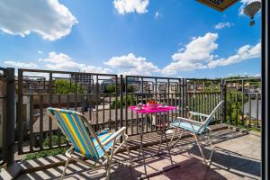 a patio with a table and chairs on a balcony at Silver Apartment With Hot Tub And Balcony - Happy Rentals in Zagreb